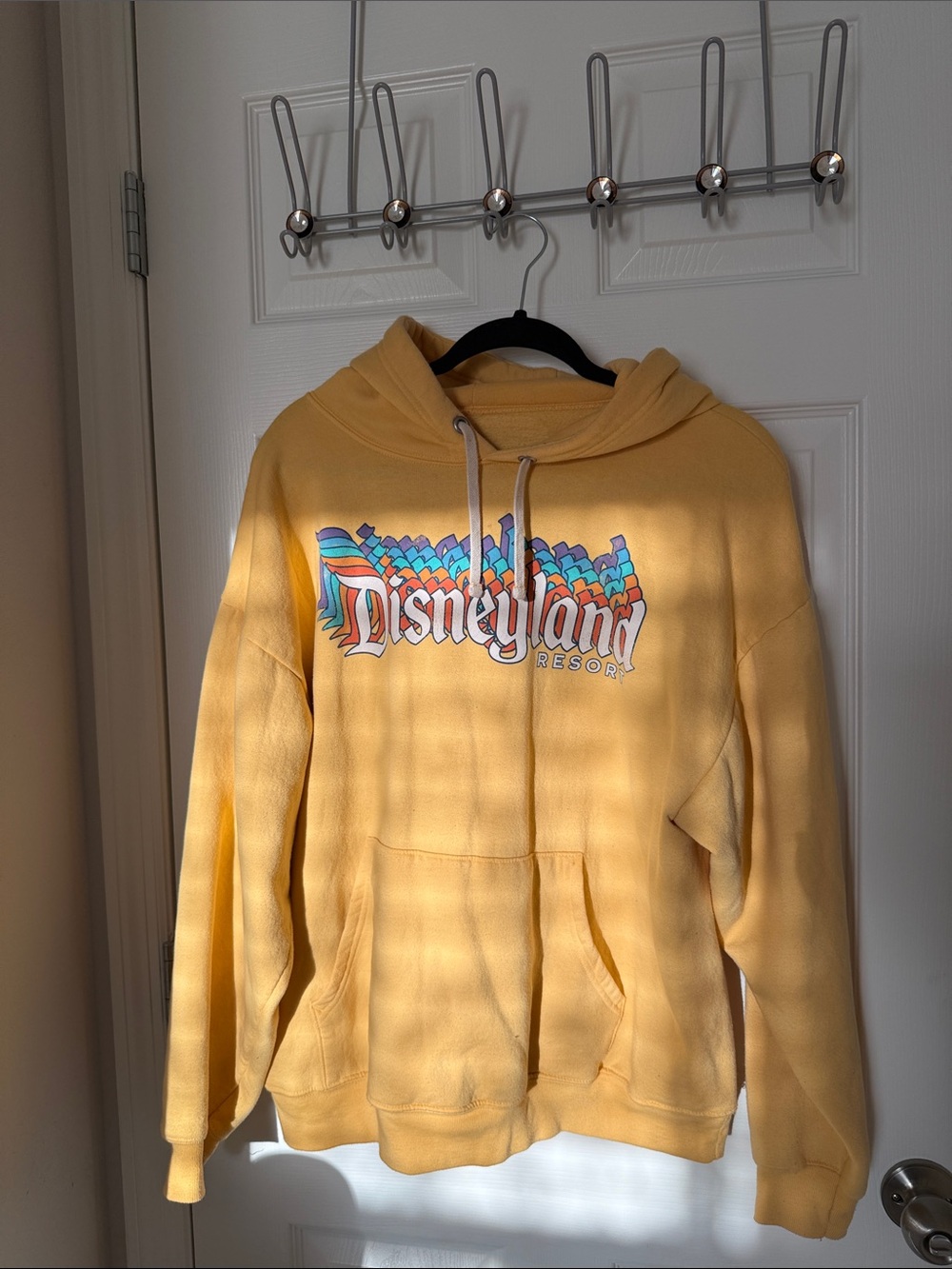 Disney Yellow Disneyland Resort Pullover Hoodie with Multicolor Logo